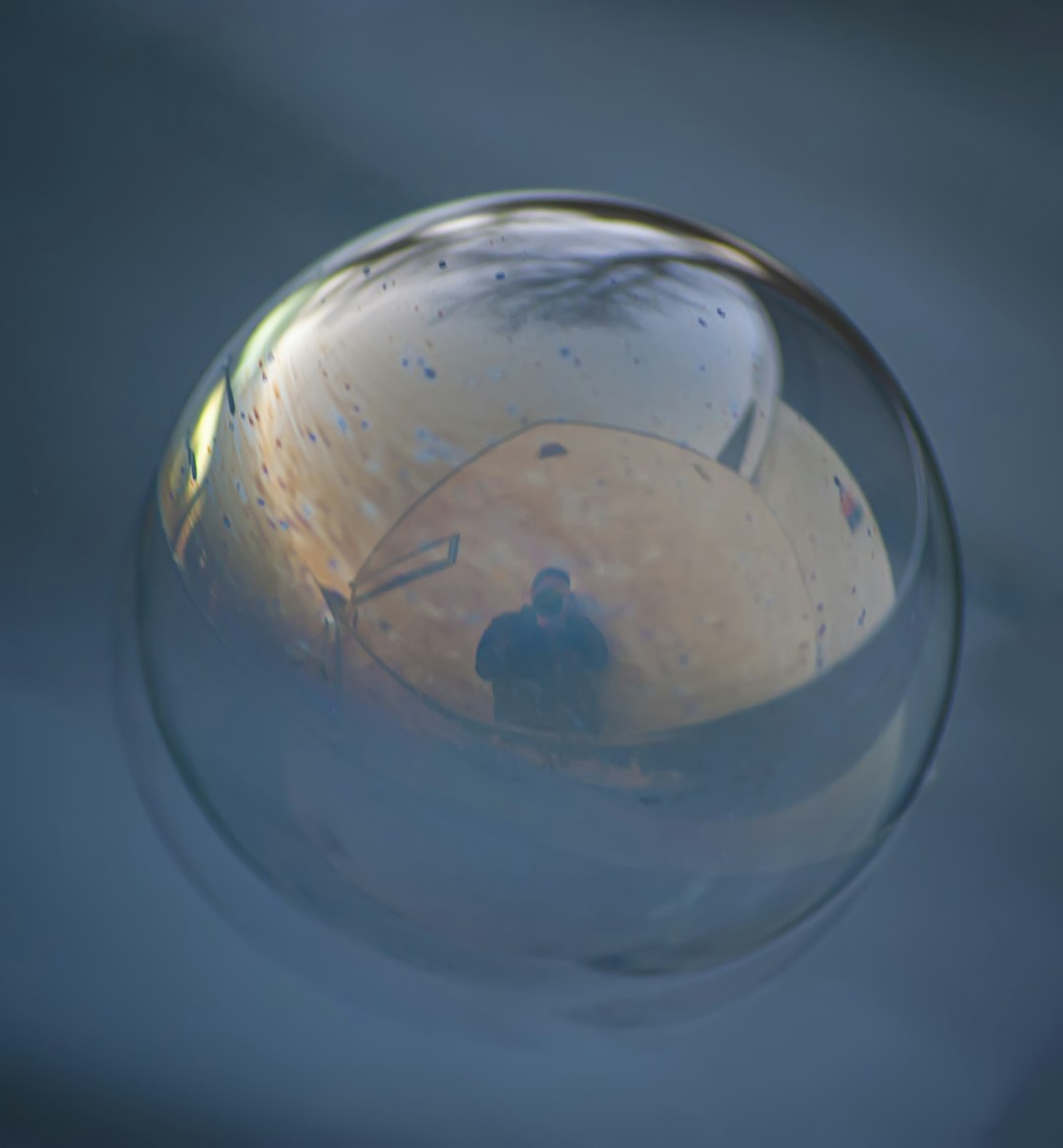 Close-up glass sphere illustrating polynucleotide skincare science conceptually